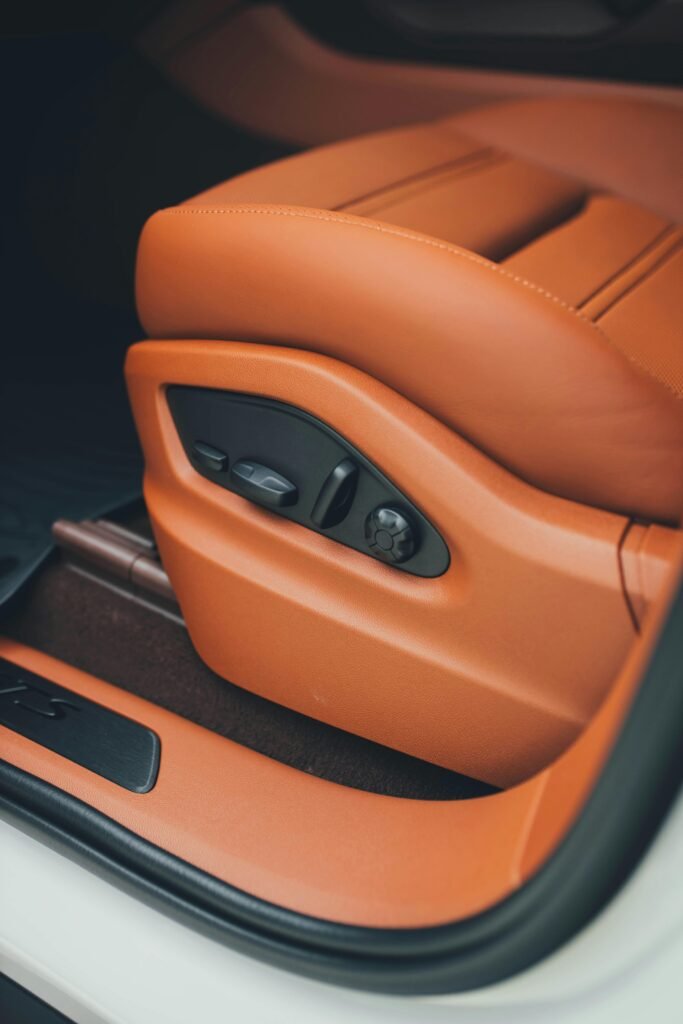 Detailed view of a luxurious automotive seat with elegant design.